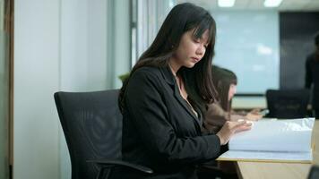 Portrait of Asian business woman is smiling in office video