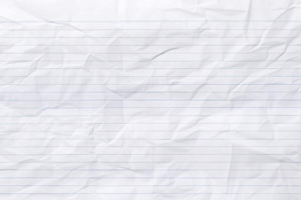 Top view empty blue lined paper with wrinkled background and texture.