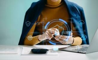 Cybersecurity and privacy concepts to protect data. Lock icon and network security technology. Man protecting personal data on smartphone tablet, virtual screen . In office photo
