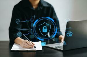 Cybersecurity and privacy concepts to protect data. Lock icon and network security technology. Man protecting personal data on smartphone tablet, virtual screen . In office photo