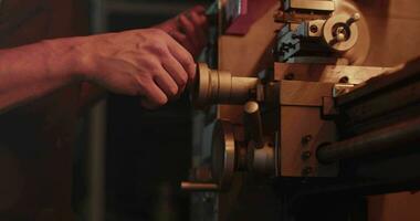 Mechanic using lathe for metal processing video