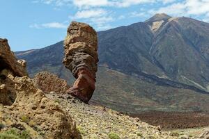 View of Mount Teide, with Roque Cinchado in the foreground. Roque Cinchado is a volcanic rock formation regarded as the symbol of the island of Tenerife, Canary Islands, Spain. Teide National Park. photo