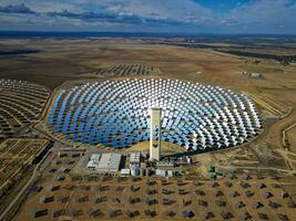 Aerial view of the Solar Power Towers PS10 and PS20 in Sanlucar la Mayor, Seville. Spain's stunning solar energy plant.  Concentrated solar power plant. Renewable energy. Green energy. photo