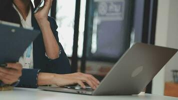 Business team collaboration discussing working analyzing with financial data and marketing growth report graph in team, presentation and brainstorming to strategy planning making profit of company. video