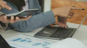 Business team collaboration discussing working analyzing with financial data and marketing growth report graph in team, presentation and brainstorming to strategy planning making profit of company. video