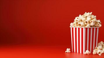 AI generated Striped Box with Popcorn on the Red Background, Copy Space. Snack, Movie, Film, Cinema photo