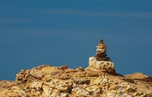 Picture of a rock on the coast of the sea They are stacked beautifully in sequence, still see island And sky clear, look relaxed. Suitable relax and travel Khao Leam Ya National Park Rayong Thailand photo