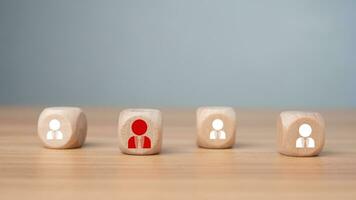 Wooden block printed icon of CRM concept representing business goal selection, target customers, marketing plan and strategy, customer centric strategy. photo