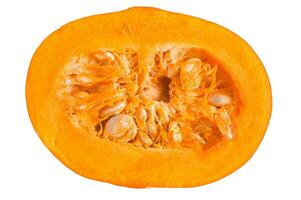 Pumpkin cut in half. A ripe orange pumpkin with a seed in the center. photo