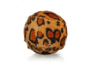 Ball for cats. The ball is covered with leopard-colored fabric for cats and kittens to play with. photo