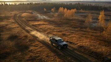 AI generated Aerial view of truck and car driving on narrow forest road, immersed in natural beauty photo