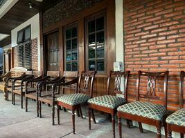 row of photos of antique chairs in front of the house
