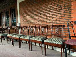 row of photos of antique chairs in front of the house