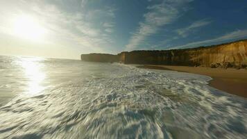 Sandy beach with a cliff in Australia. Fpv Drone Video. video