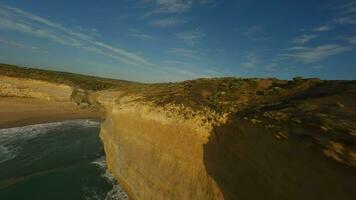 Flying over a cliff and the sea in Australia on an FPV drone video