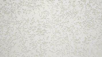 Texture of white ribby stucco on cement wall. photo