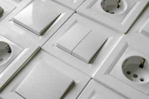 Many European outlets and switches are located next to each other. photo