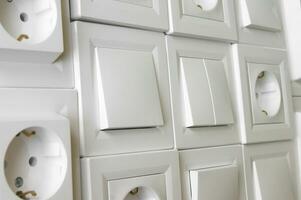 Many European outlets and switches are located next to each other photo