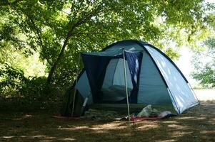 Small camping in a green forest. photo