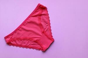 A women panties on a pink background. photo