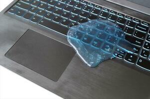 Blue soft gel cleaning dust on keyboard. photo