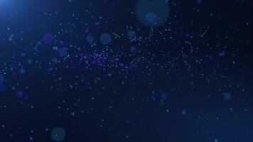Abstract background of multi-colored particles. Particles swirl and fly. colored shiny background. dust particles and beautiful bokeh on a blue background. seamless loop. video