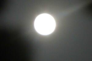 Full Moon light on dark sky image. photo