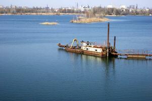 Large industrial pump for pumping sand from the bottom of the lake. photo