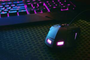 Workspace with a keyboard and mouse on dark background. photo