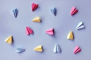 Multi-colored paper airplanes. photo