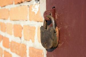 Old castle on closed iron doors. photo