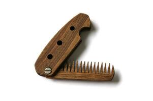 Male wooden comb for beard and hair isolated on a white background. photo