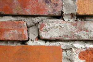 Old red brick wall close-up. photo