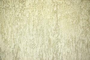 Texture of ivory ribby stucco on cement wall. photo