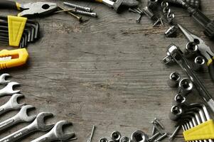 Working tools on wooden rustic background. photo