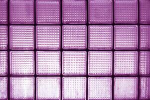 Violet surfaces dirty glass block wall for effect background. photo