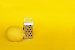 Fresh lemons isolated on a yellow background. photo