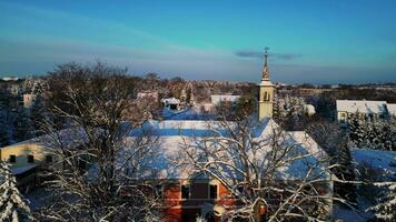 Aerial descending view of snowy castle early morning video