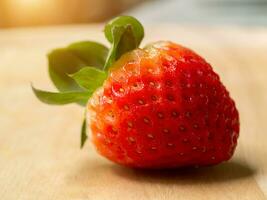 Close up of strawberry on wood. photo