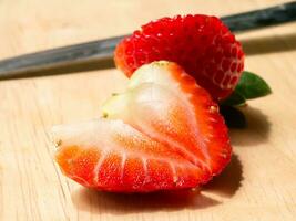 Close up of strawberry on wood. photo
