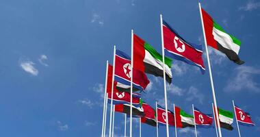 North Korea and United Arab Emirates, UAE Flags Waving Together in the Sky, Seamless Loop in Wind, Space on Left Side for Design or Information, 3D Rendering video