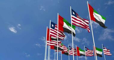Liberia and United Arab Emirates, UAE Flags Waving Together in the Sky, Seamless Loop in Wind, Space on Left Side for Design or Information, 3D Rendering video