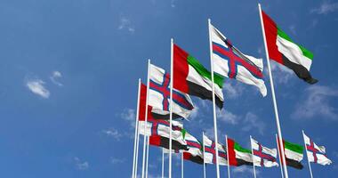 Faroe Islands and United Arab Emirates, UAE Flags Waving Together in the Sky, Seamless Loop in Wind, Space on Left Side for Design or Information, 3D Rendering video