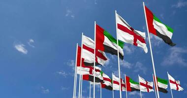 Inglaterra y unido árabe emiratos, uae banderas ondulación juntos en el cielo, sin costura lazo en viento, espacio en izquierda lado para diseño o información, 3d representación video