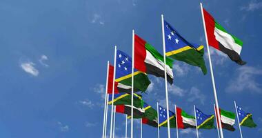 Solomon Islands and United Arab Emirates, UAE Flags Waving Together in the Sky, Seamless Loop in Wind, Space on Left Side for Design or Information, 3D Rendering video