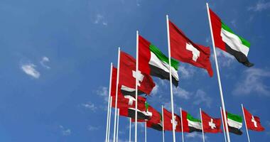 Switzerland and United Arab Emirates, UAE Flags Waving Together in the Sky, Seamless Loop in Wind, Space on Left Side for Design or Information, 3D Rendering video