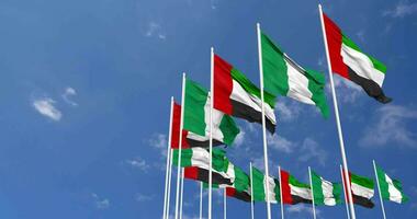 Nigeria and United Arab Emirates, UAE Flags Waving Together in the Sky, Seamless Loop in Wind, Space on Left Side for Design or Information, 3D Rendering video