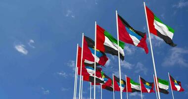Antigua and Barbuda and United Arab Emirates, UAE Flags Waving Together in the Sky, Seamless Loop in Wind, Space on Left Side for Design or Information, 3D Rendering video