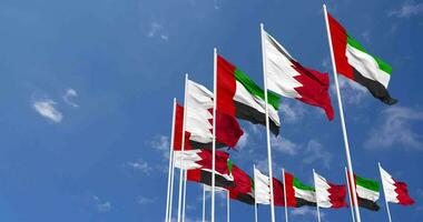 Bahrain and United Arab Emirates, UAE Flags Waving Together in the Sky, Seamless Loop in Wind, Space on Left Side for Design or Information, 3D Rendering video