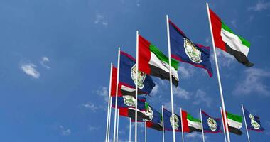 Belize and United Arab Emirates, UAE Flags Waving Together in the Sky, Seamless Loop in Wind, Space on Left Side for Design or Information, 3D Rendering video